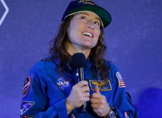 After historic moon mission, astronaut's homecoming gets tail-wagging welcome
