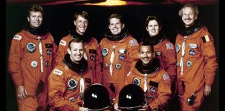 Why do astronauts wear bright orange flight suits?
